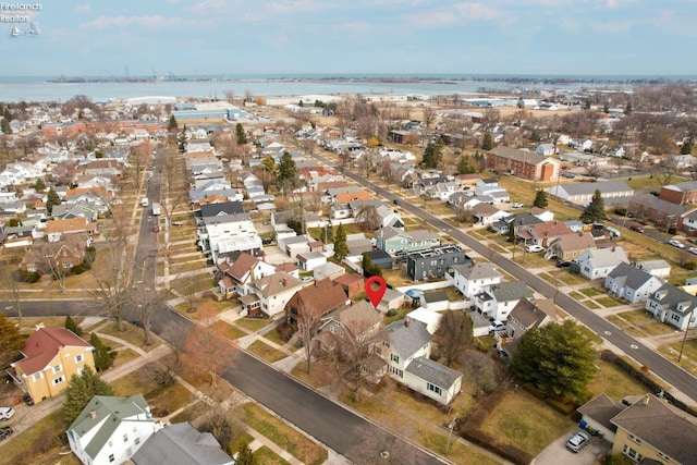 bird's eye view featuring a water view and a residential view