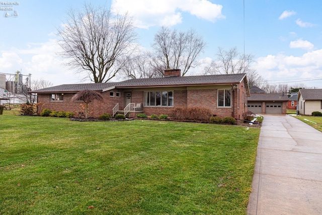 ranch-style house featuring crawl space, brick siding, a garage, and a front yard