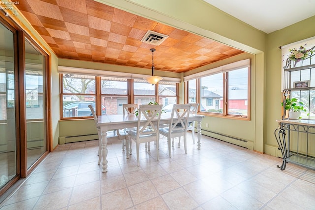 unfurnished dining area featuring a baseboard radiator and visible vents