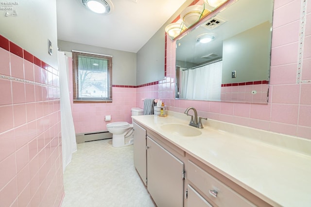 full bathroom with tile walls, visible vents, toilet, baseboard heating, and vanity