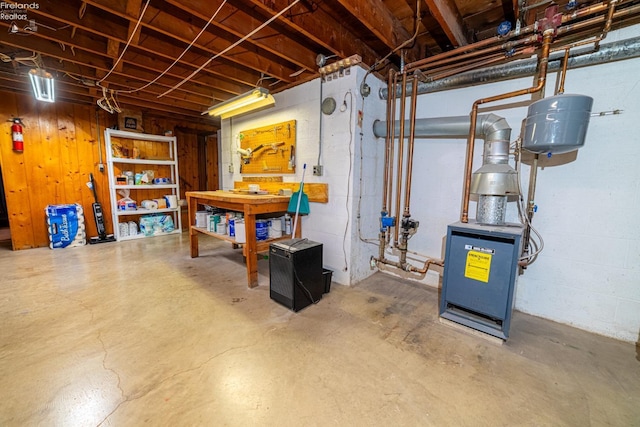 unfinished basement featuring a workshop area