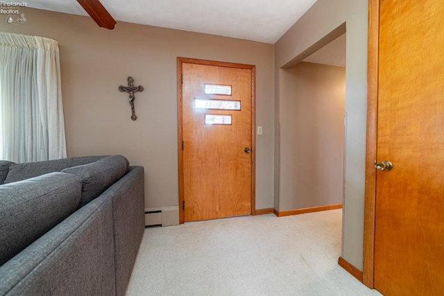 carpeted foyer featuring beamed ceiling, baseboard heating, and baseboards