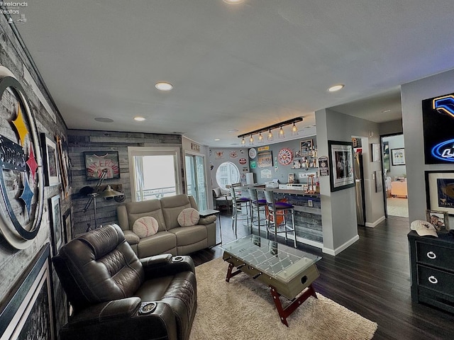 living area featuring track lighting, baseboards, wood finished floors, and recessed lighting