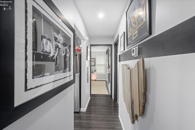 corridor with dark wood-type flooring