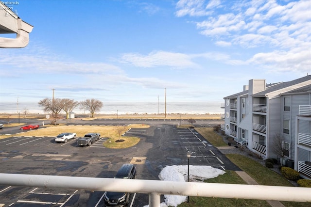 exterior space featuring a beach view and a water view