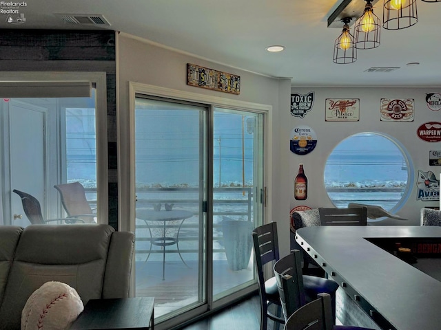 interior space with an inviting chandelier and visible vents