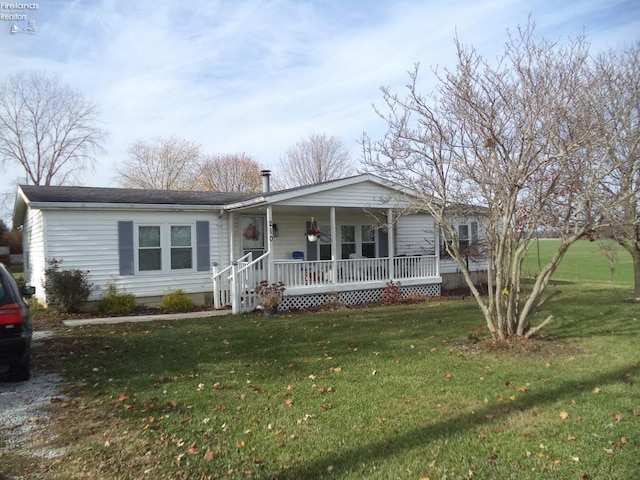 ranch-style home with a porch and a front lawn