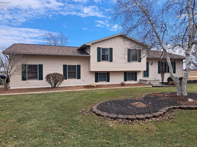 split level home with a front yard