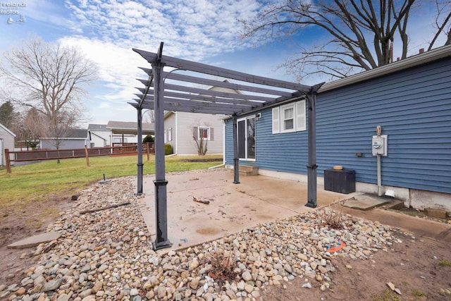 view of yard featuring a patio area, fence, and a pergola