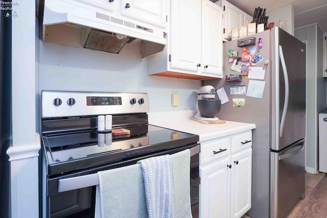 kitchen with under cabinet range hood, light countertops, stainless steel appliances, wood finished floors, and white cabinetry