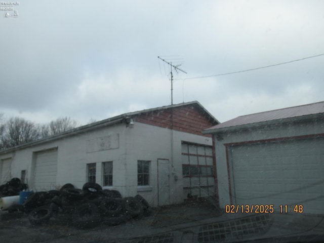 view of side of property with an outbuilding