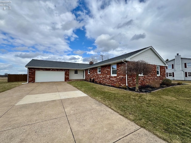 ranch-style home with a garage, brick siding, fence, concrete driveway, and a front lawn