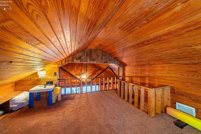 bonus room featuring wooden ceiling, carpet, visible vents, and wooden walls