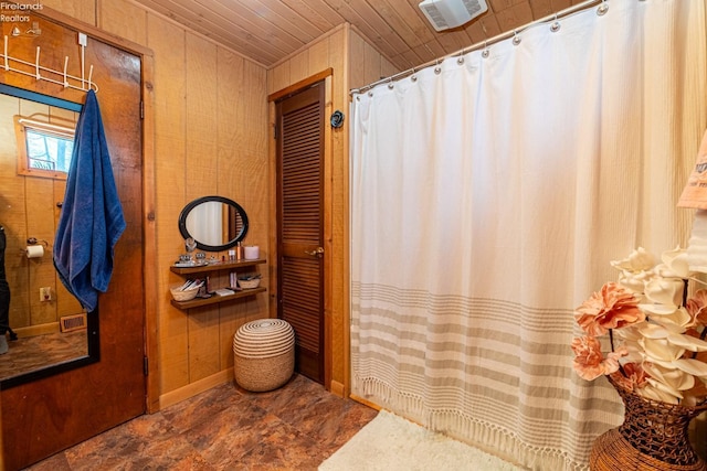 full bath featuring wood ceiling, wood walls, visible vents, and a shower with curtain