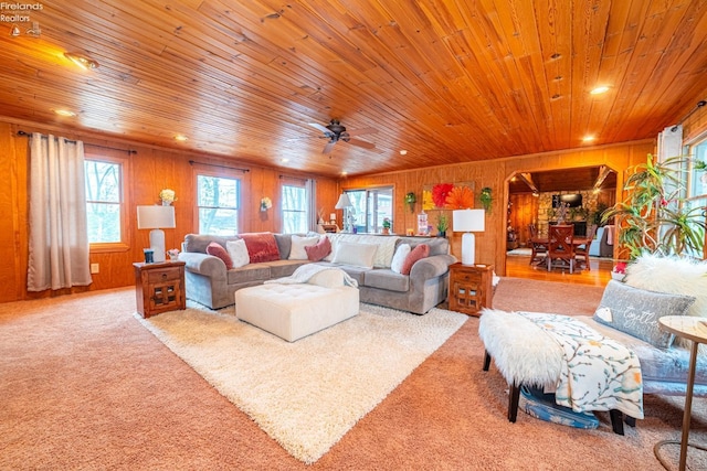 living area with wooden ceiling, ceiling fan, carpet, wood walls, and recessed lighting