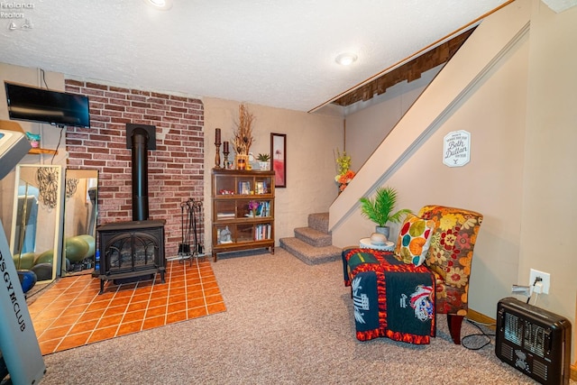 interior space with a wood stove, heating unit, a textured ceiling, and carpet flooring