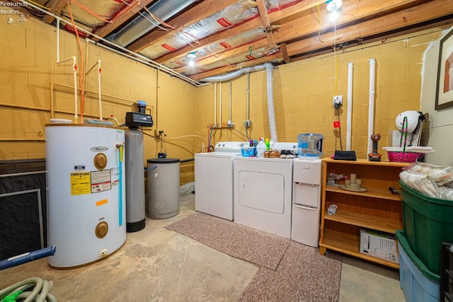 unfinished basement featuring water heater and separate washer and dryer