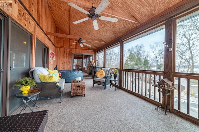 sunroom with lofted ceiling and ceiling fan