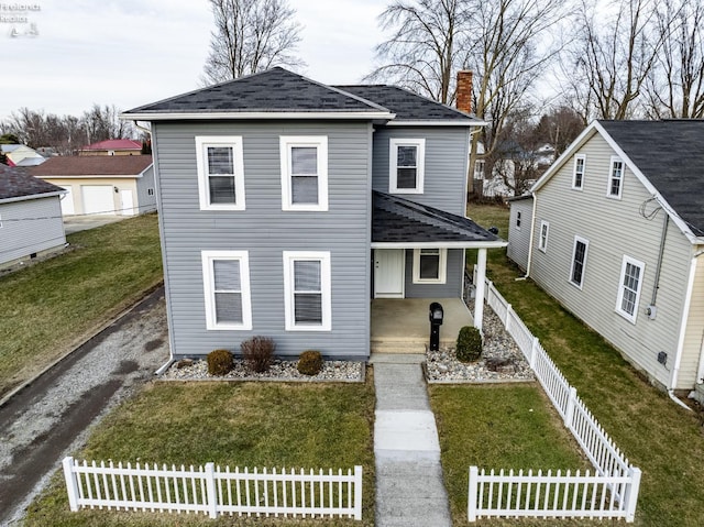 traditional home featuring a chimney, roof with shingles, fence private yard, covered porch, and a front yard