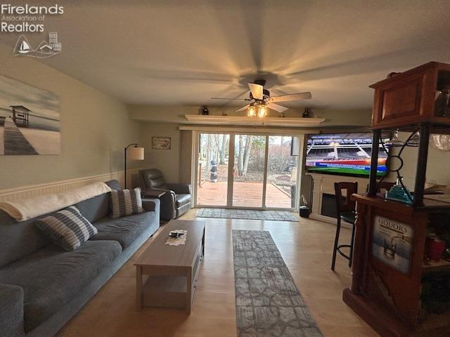 living area with a ceiling fan