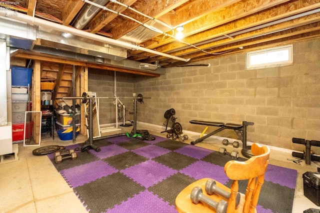 workout area featuring concrete block wall