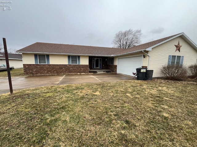 single story home with an attached garage, brick siding, and a front yard