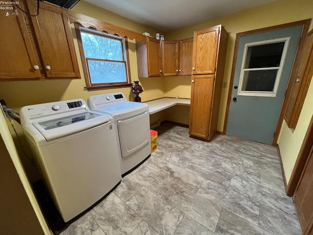 laundry room with washer and dryer and cabinet space