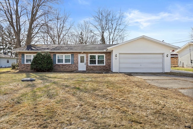 ranch-style house featuring driveway, an attached garage, a front yard, and brick siding