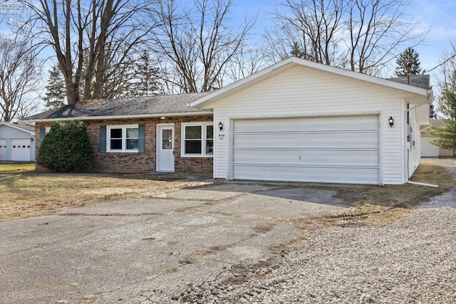 ranch-style house with driveway, brick siding, an attached garage, and a shingled roof