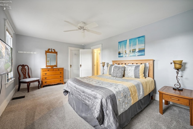 bedroom with carpet, visible vents, ceiling fan, and baseboards