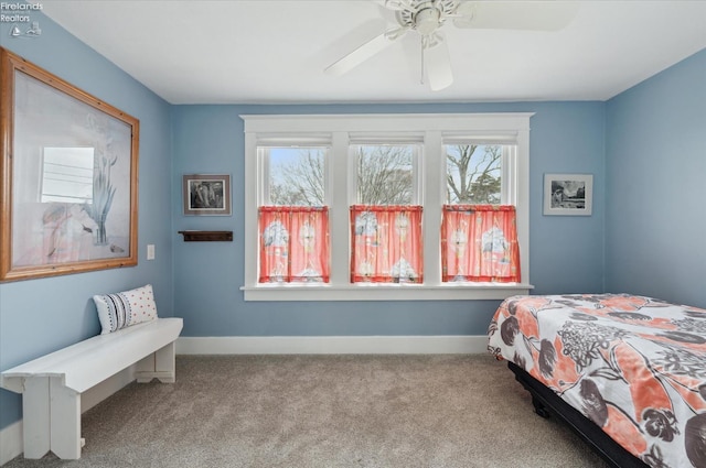 bedroom with carpet floors, a ceiling fan, and baseboards