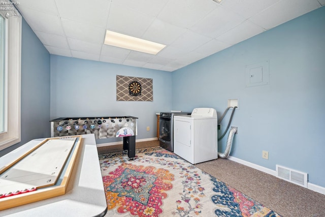 washroom with baseboards, visible vents, washer and clothes dryer, and carpet flooring