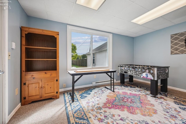 home office with baseboards, a baseboard heating unit, and carpet flooring