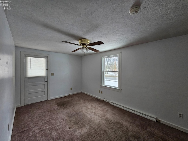 carpeted empty room featuring a ceiling fan, a baseboard radiator, baseboards, and a textured ceiling