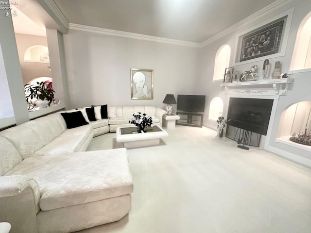 carpeted living area with ornamental molding and a fireplace with flush hearth