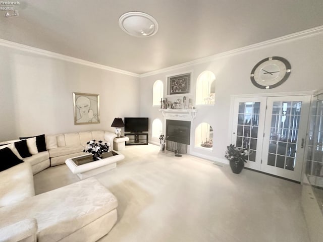 living area featuring crown molding and a fireplace