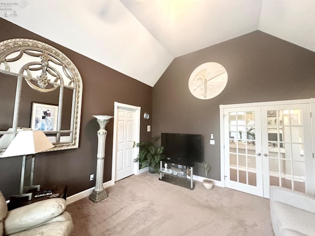 living room featuring carpet floors, high vaulted ceiling, baseboards, and french doors