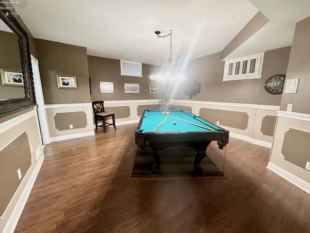 recreation room with a wainscoted wall, a decorative wall, wood finished floors, and pool table