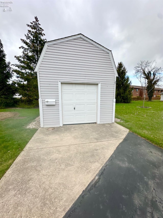 garage featuring driveway