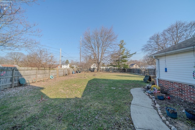 view of yard with a fenced backyard