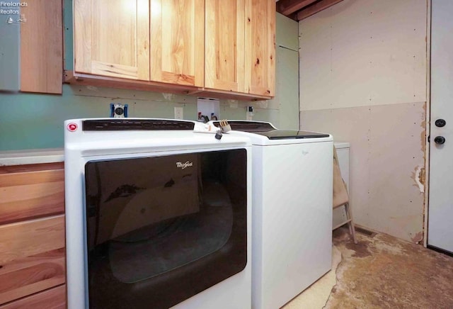 laundry room with cabinet space and independent washer and dryer