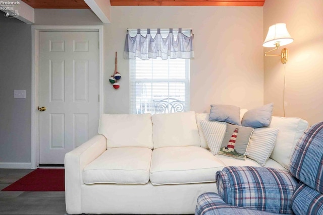 living area featuring wood finished floors and baseboards