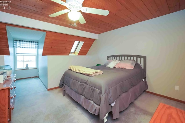 bedroom with wooden ceiling, light carpet, and baseboards