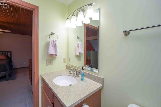 bathroom featuring wood ceiling and vanity