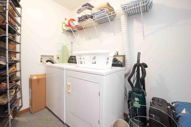 laundry area featuring laundry area, light colored carpet, and independent washer and dryer