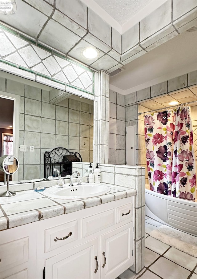 full bath featuring shower / tub combo, tile walls, and vanity