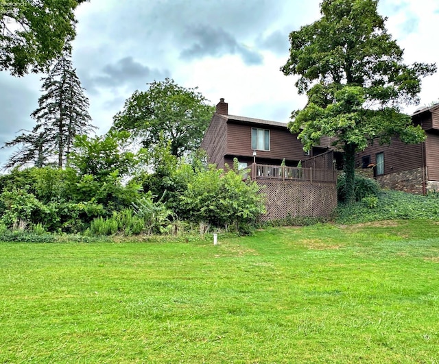 view of yard with a wooden deck