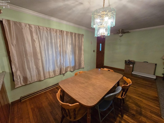 dining area featuring hardwood / wood-style flooring, baseboards, a chandelier, and crown molding