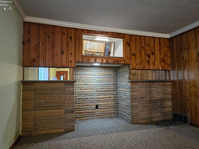 interior space featuring carpet, visible vents, and crown molding