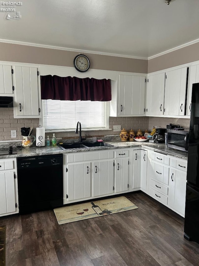 kitchen with black appliances, ventilation hood, a sink, and crown molding